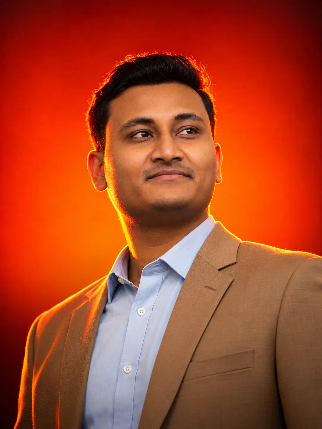 Anik Hassan in a tan blazer